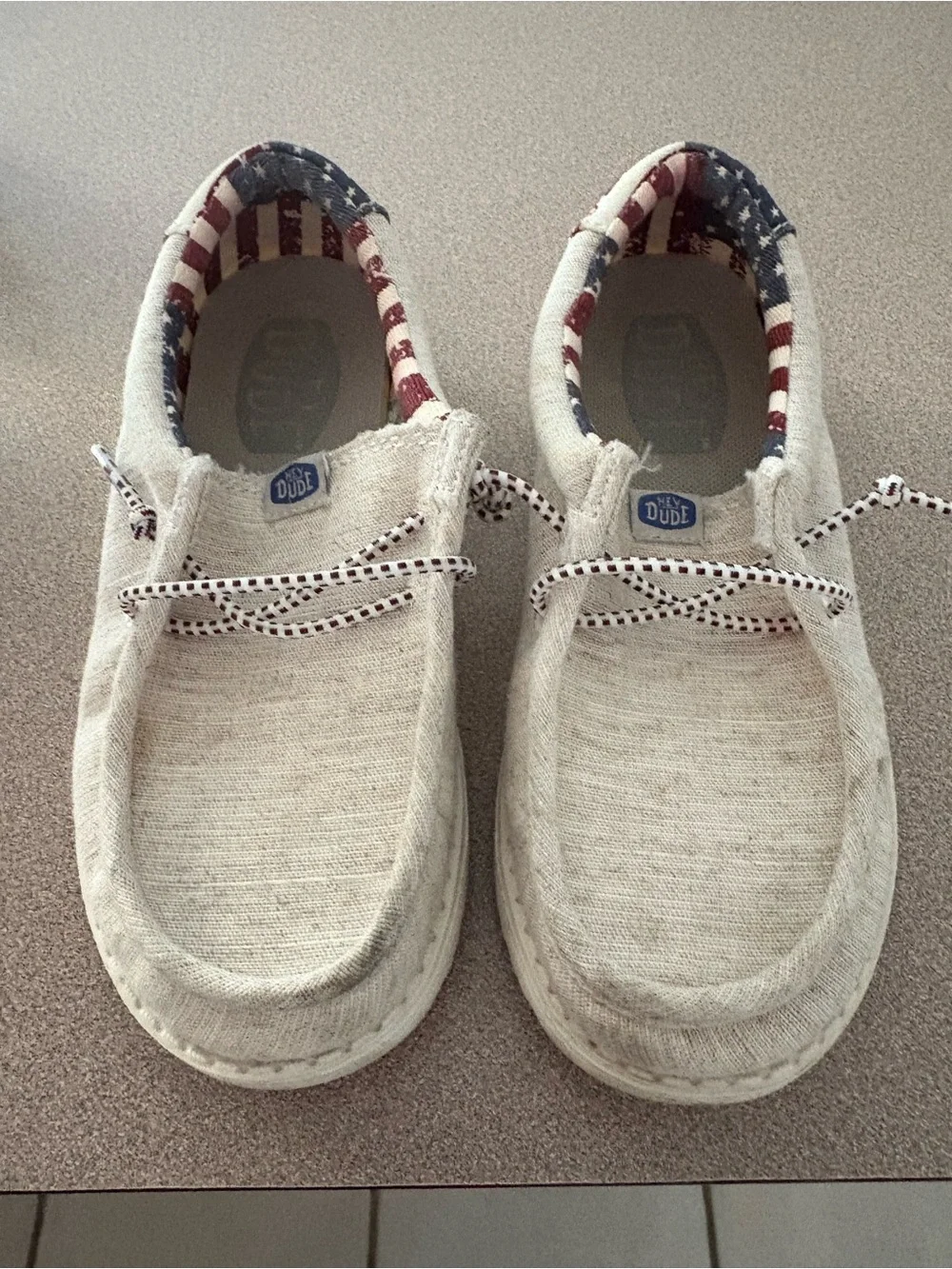 Hey Dude Kids Slip-On Sneakers in Natural with Red & Blue Flag Lining